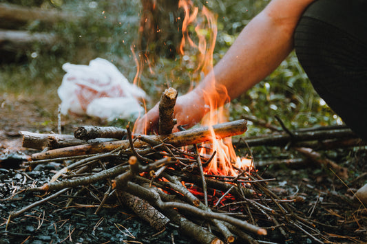 Close-Up Shot of a Person Making a Camp Fire
